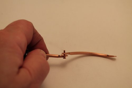 Judy Freyer Thompson's Articulated Copper Wire Bracelet - , Contemporary Wire Jewelry, How To Punch Holes, Hole Punching, Punch A Hole, Riveting, Riveting Techniques, Wire Rivets, attach two pieces of bracelet with a rivet